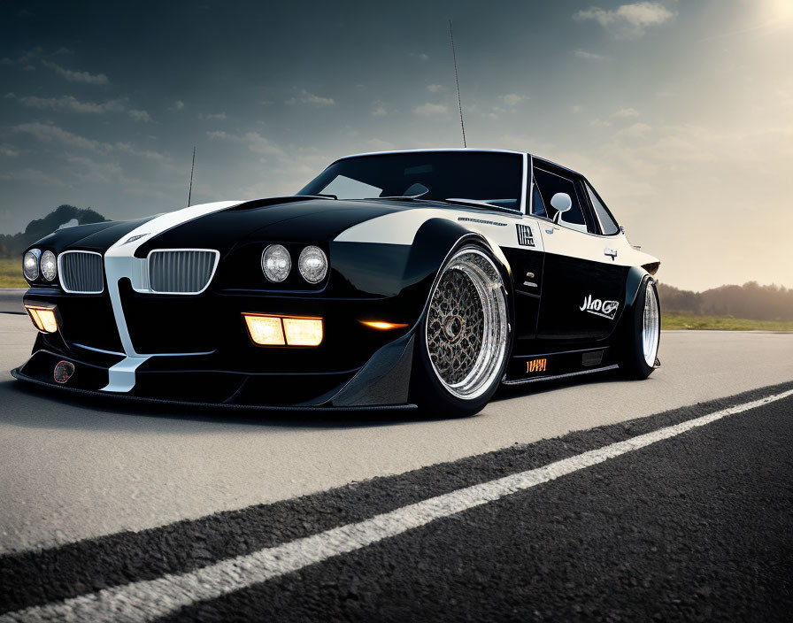 Black Modified Sports Car with Wide-Body Kit and Deep-Dish Wheels on Asphalt Road