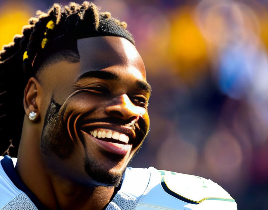 Smiling athlete with braided hair in stadium scene