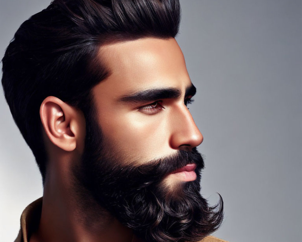 Man with Well-Groomed Beard and Slicked-Back Hair in Tan Garment