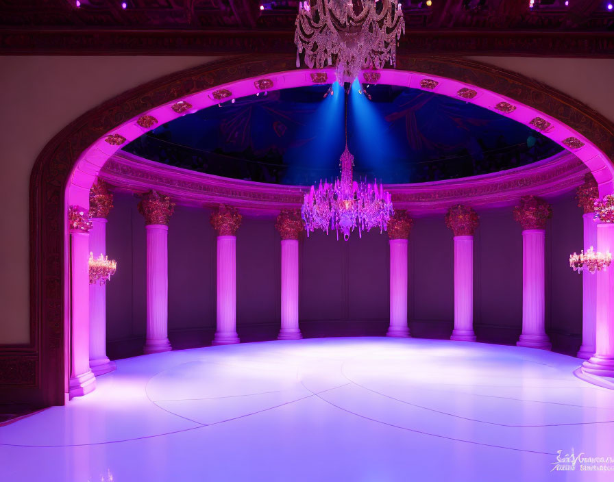 Sophisticated event hall with purple lighting, white columns, chandelier, and vaulted archway