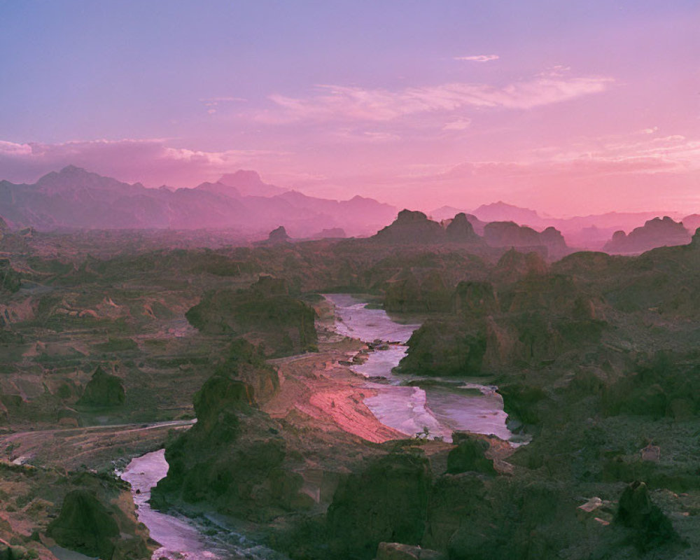 Serene twilight over winding river and rugged mountains in soft pink and purple sky