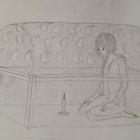 Melancholic girl sitting in ornate treasure chest with candle