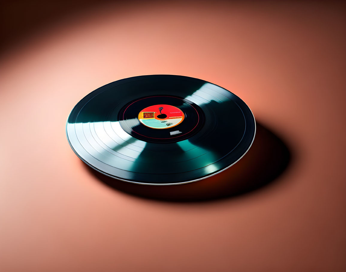 Red label vinyl record on surface under warm light