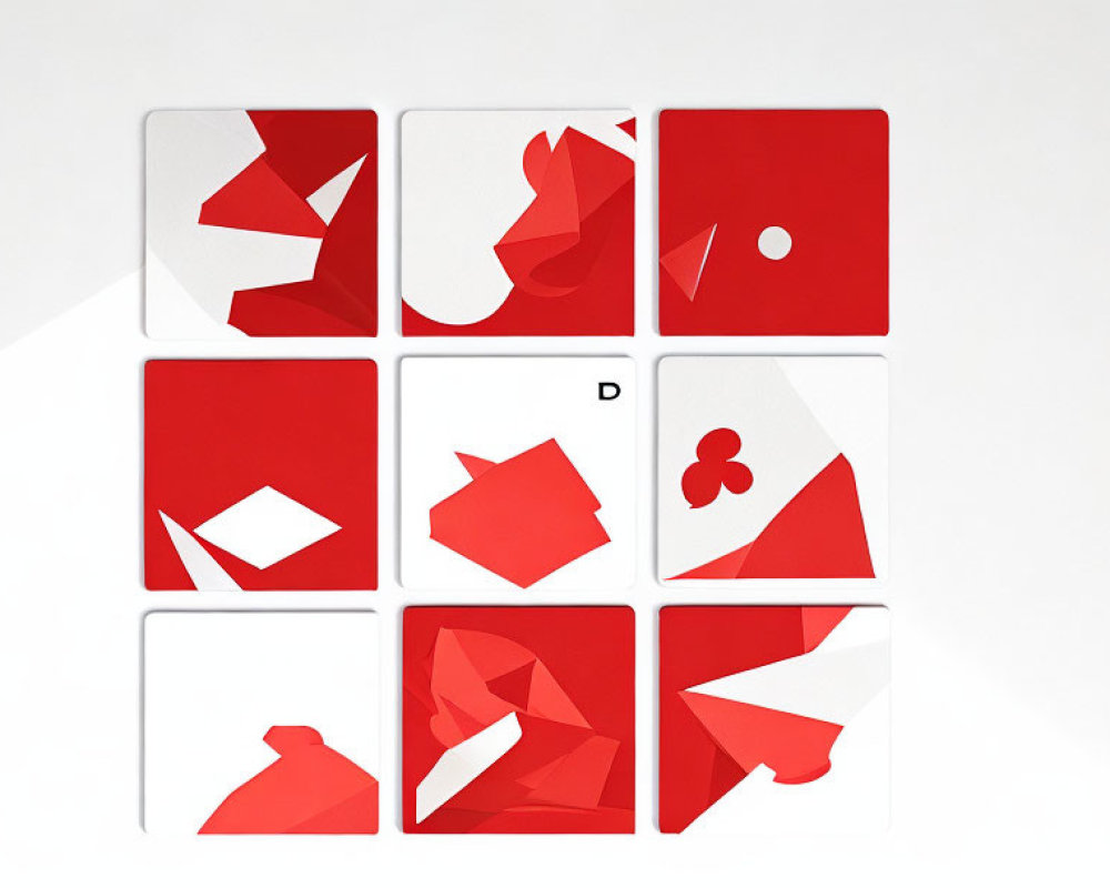 Abstract red and white geometric shapes on nine square tiles forming playing card symbols.