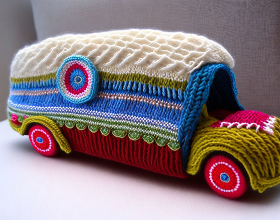 Vibrant knitted bus with colorful intricate patterns