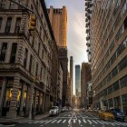 City street with vintage cars and ornate buildings under golden sunlight