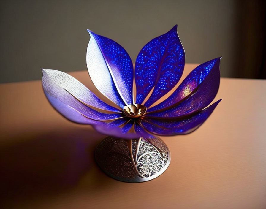 Metallic Blue and White Flower with Intricate Cut-Out Patterns on Softly Lit Surface