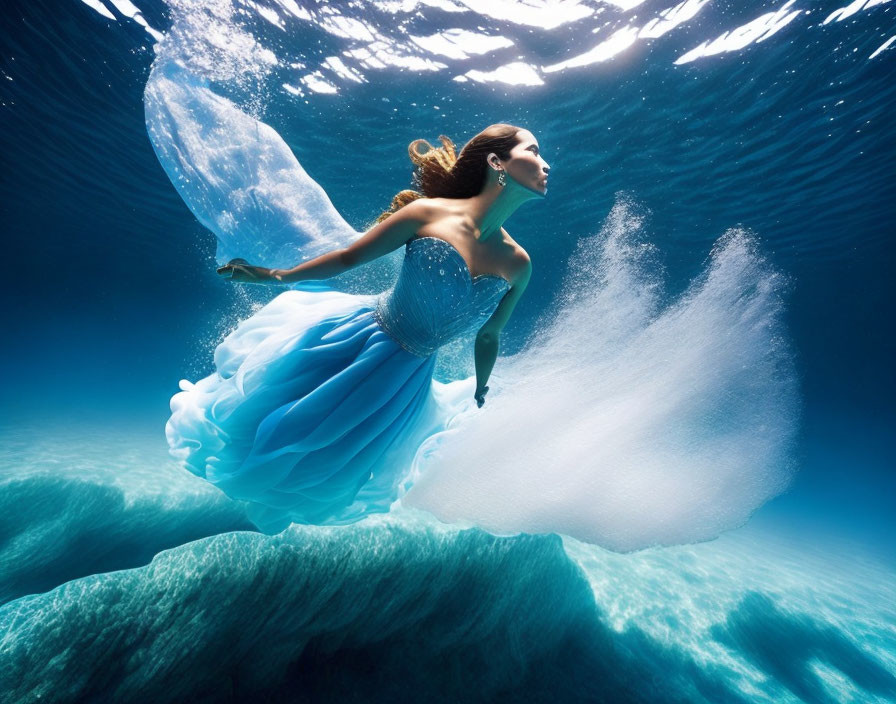 Person in Blue Gown Immersed Underwater with Sunlight