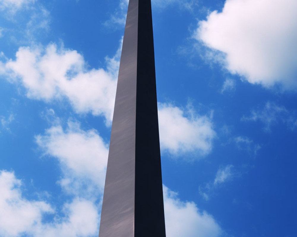 Tall slender monument under clear blue sky