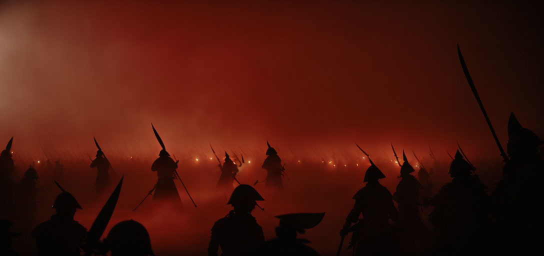 Soldiers in historical uniforms with bayonets on foggy battlefield