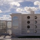 Traditional House Next to Futuristic Spherical Structure on Suburban Street