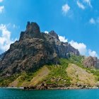 Colorful Castles and Sailing Ship in Vibrant Seascape