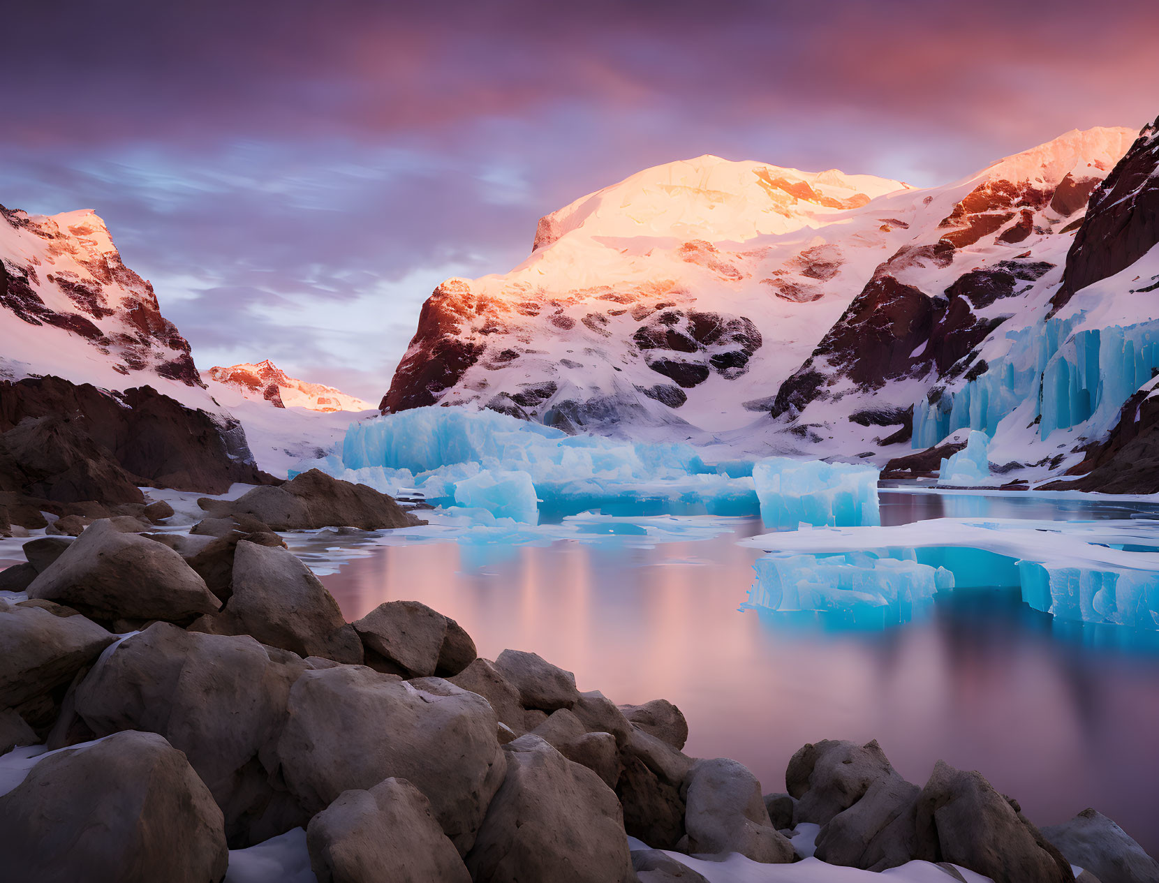 Tranquil Polar Sunset Landscape with Snowy Mountains and Reflective Water