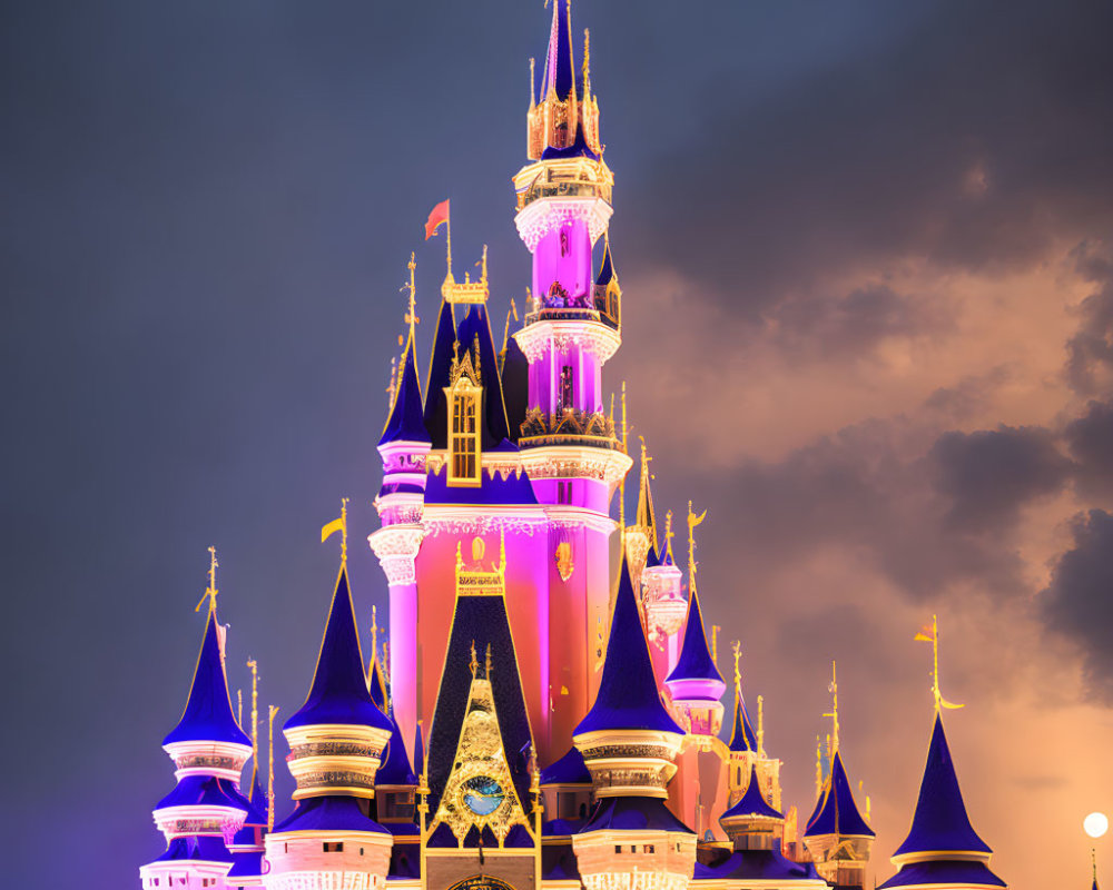 Fairytale castle with tall spires and grand clock against twilight sky