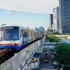 Futuristic train in advanced cityscape with skyscrapers