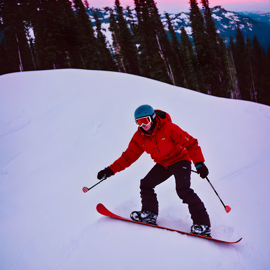 Skier in Red Jacket and Blue Helmet Skiing on Snowy Slope