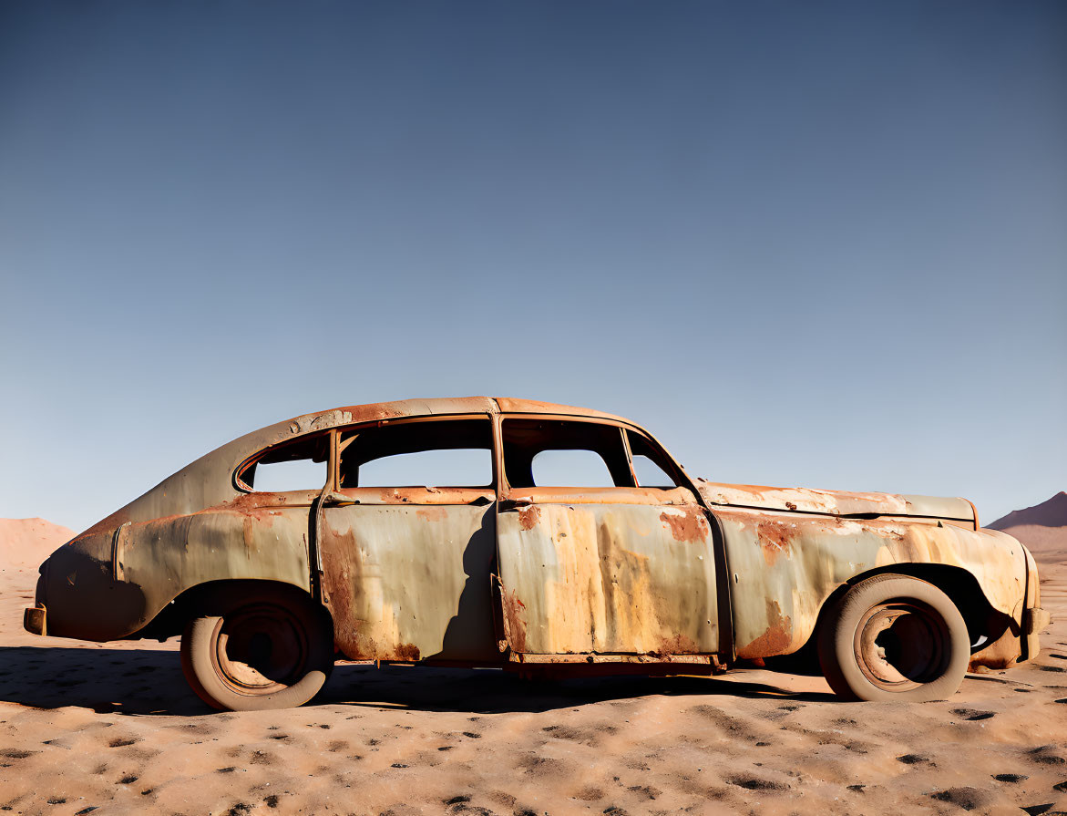 Abandoned Rusty Car in Desert Landscape