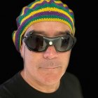 Colorful Beanie and Reflective Sunglasses on Bearded Person