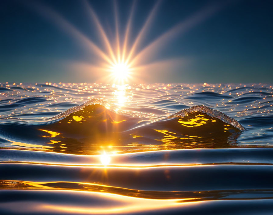 Golden sunset rays illuminate ocean waves in serene image