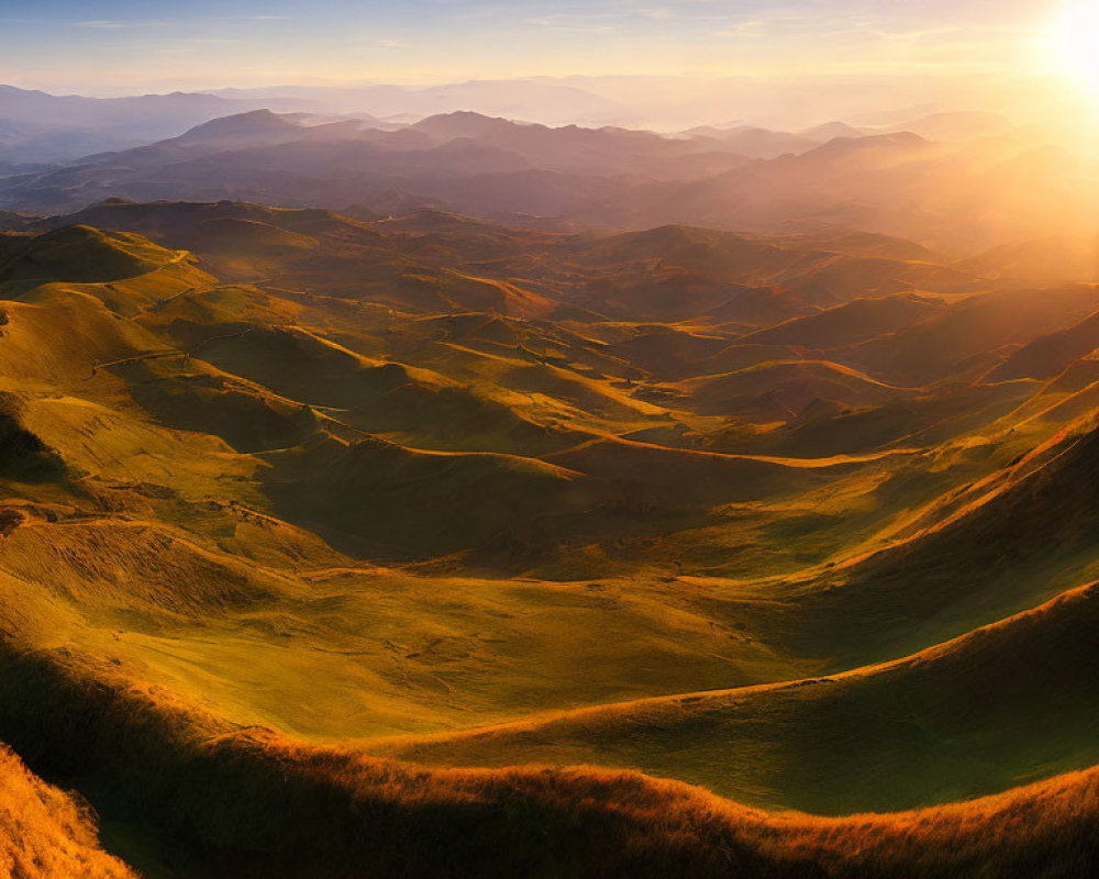 Sunrise over rolling hills and mountains landscape view