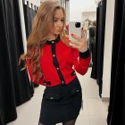 Long-haired woman in mirror corridor selfie with red blouse and black skirt