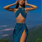 Woman in Blue Dress Posing Against Sky Backdrop