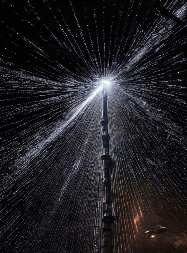 Tall illuminated structure with radiant light rays at night