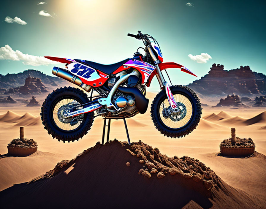 Motocross bike with racing decals mid-air over sandy desert mound
