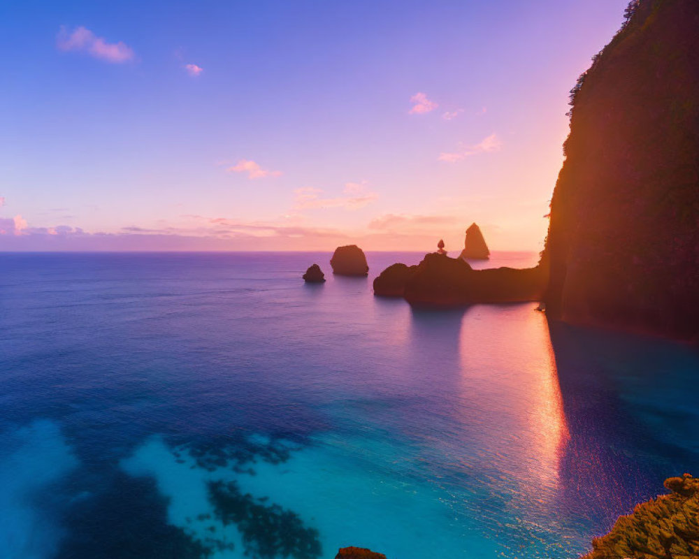 Serene sea at twilight with rocky islets and gradient sky