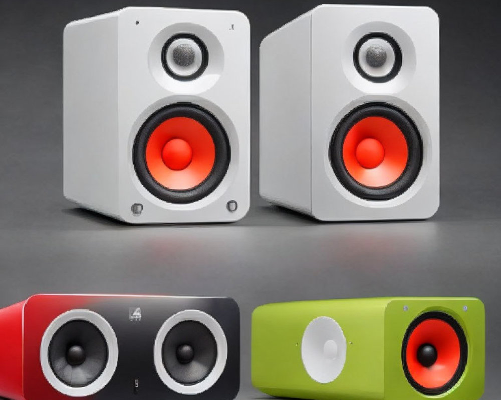 Four Modern Two-Tone Speakers with Central Woofers in Various Color Combinations