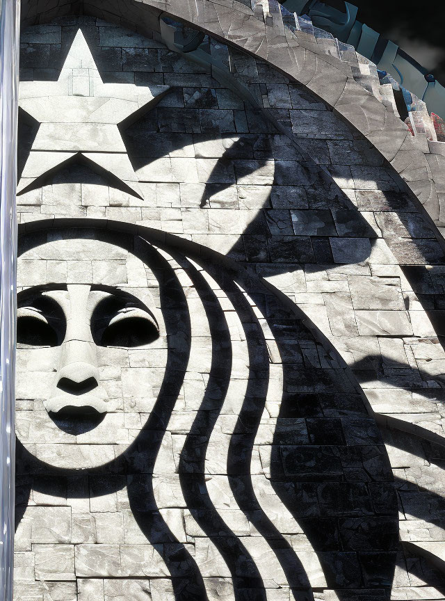 Stylized Starbucks logo mural with monochrome siren figure on exterior wall