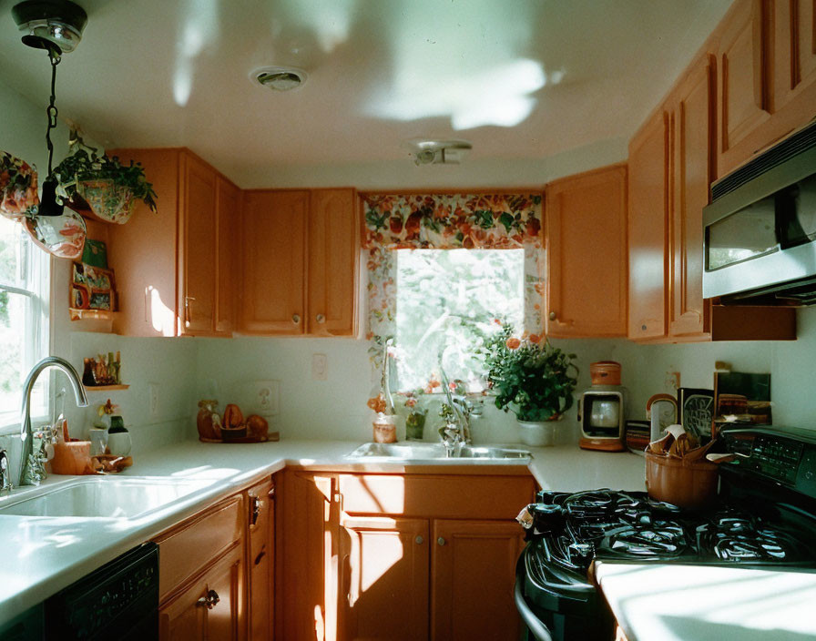 Peach-Colored Cabinets in Cozy Kitchen with Floral Curtain