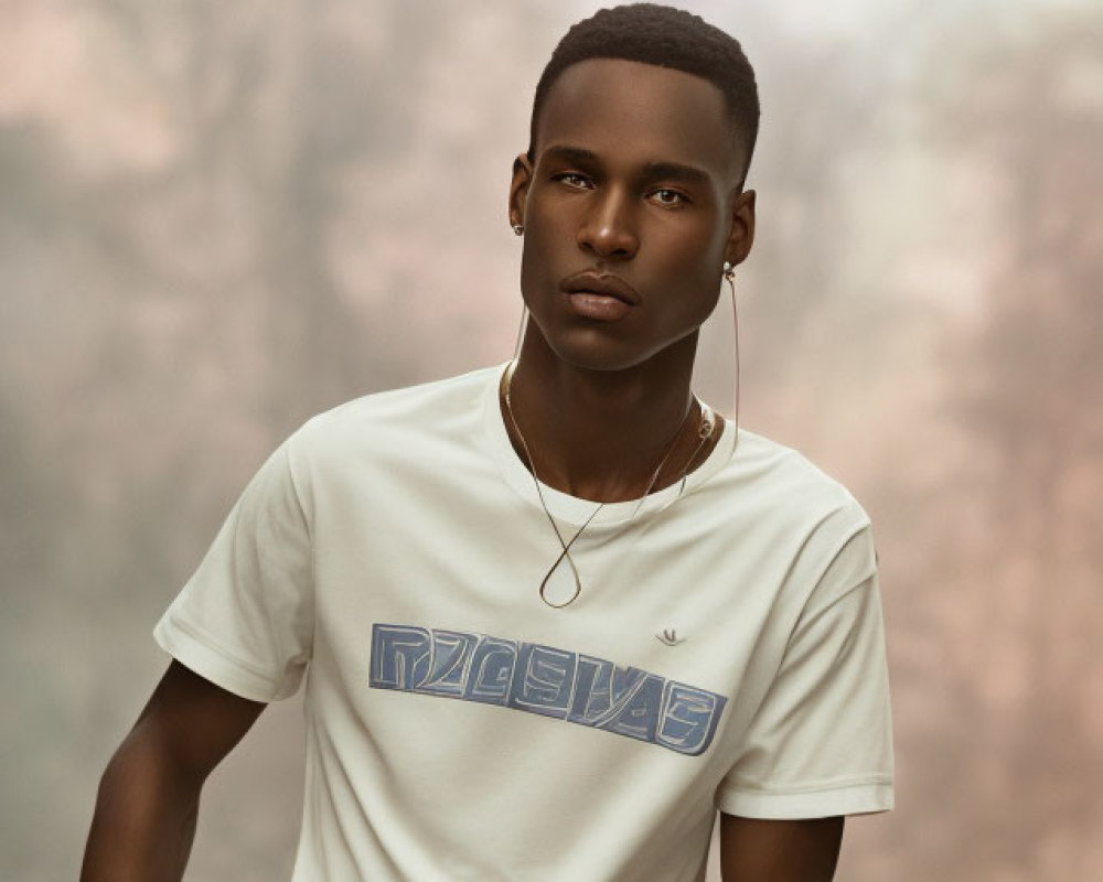 Confident young man in white t-shirt against soft-focus background