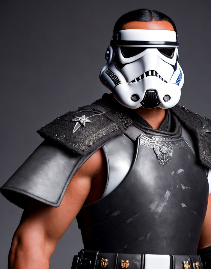 Person wearing Stormtrooper helmet with shoulder pad and vest in warrior aesthetic.