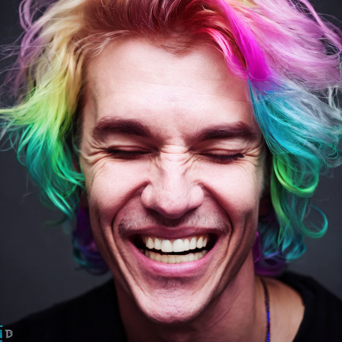 Multicolored Hair Person Laughing with Eyes Closed on Grey Background