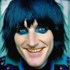 Portrait of a person with blue eye makeup and black hair in a blue outfit