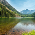 Tranquil landscape with river, greenery, mountain, and broken structure