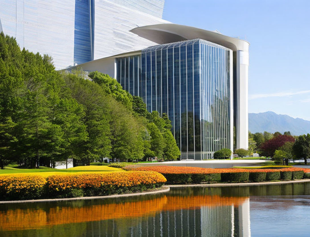 Curved Glass Building Amid Lush Greenery and Reflective Pond