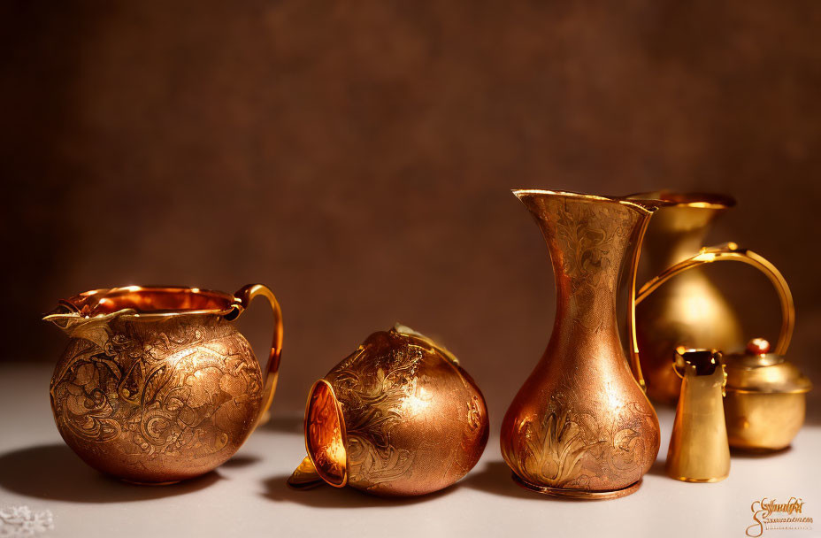 Ornate Golden Pitchers and Pots on Brown Background