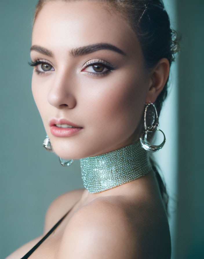 Portrait of a woman with choker and earrings in soft focus