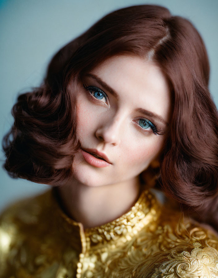 Portrait of Woman with Blue Eyes and Chestnut Hair in Golden Top