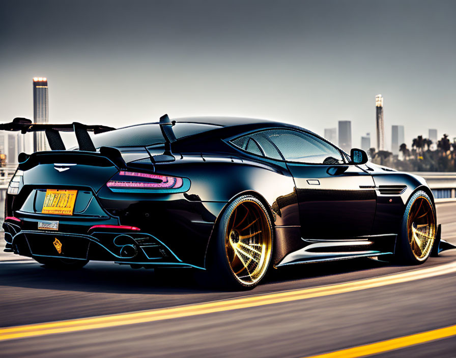 Black Sports Car with Golden Rims Driving on Road with City Skyline at Dusk