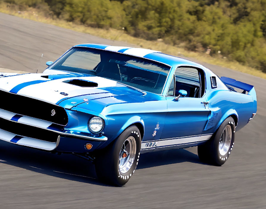 Blue Vintage Shelby Mustang with White Racing Stripes on Track