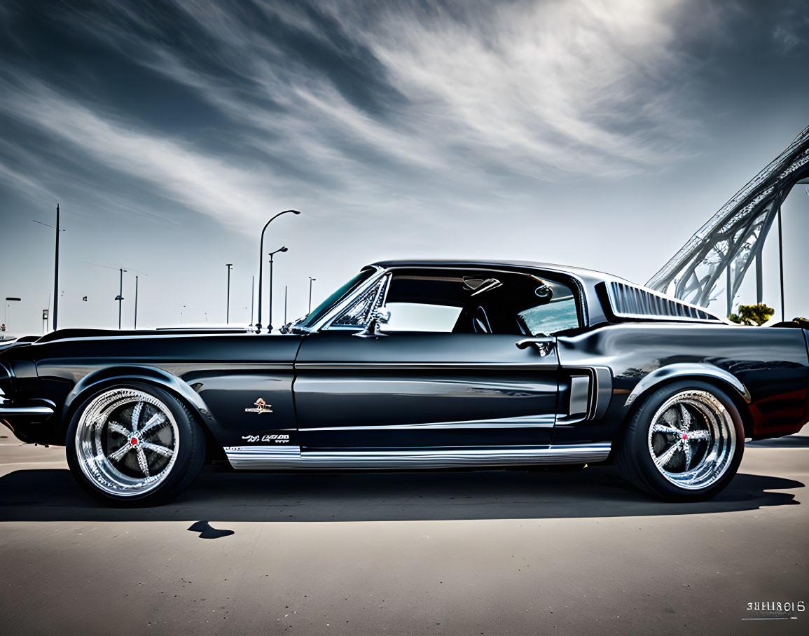 Vintage Black Ford Mustang with Chrome Wheels and Bridge Background