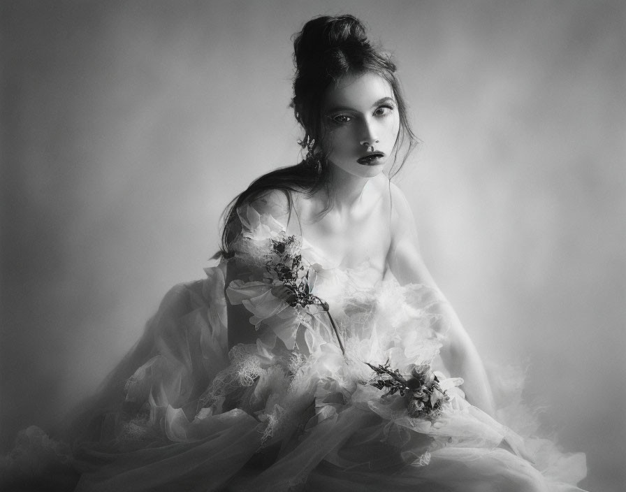 Woman in White Flowy Dress with Dark Lipstick and Flowers in Monochromatic Setting