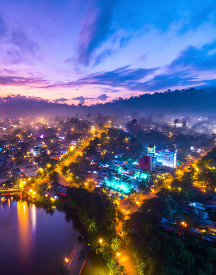 Town at Twilight: Aerial View with Street Lights, River, Mist, and Colorful Sky