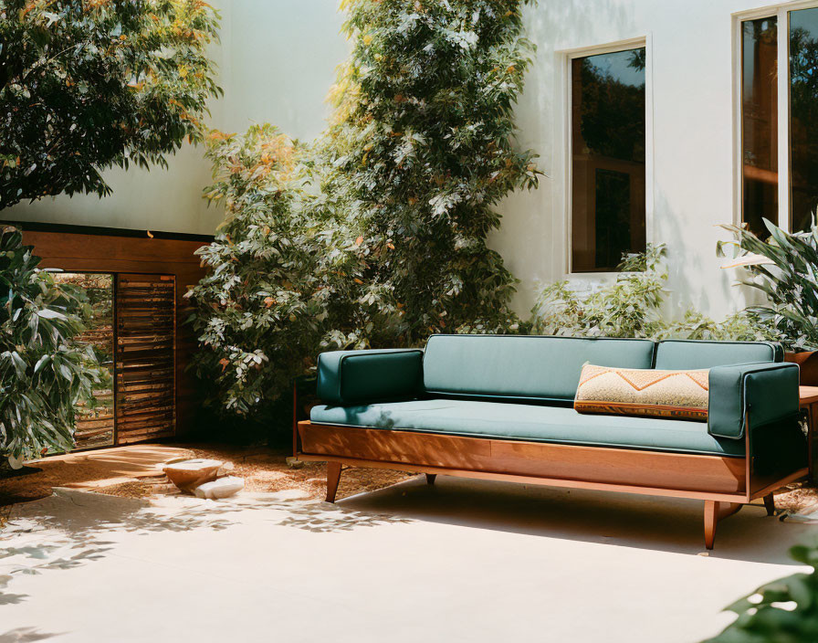 Modern Teal Sofa with Wooden Sideboard in Stylish Outdoor Seating Area