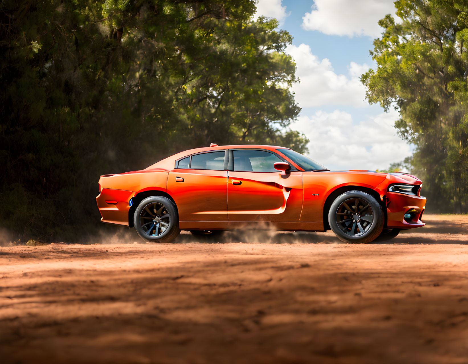 Orange sports car driving on dirt road surrounded by green trees under sunny sky