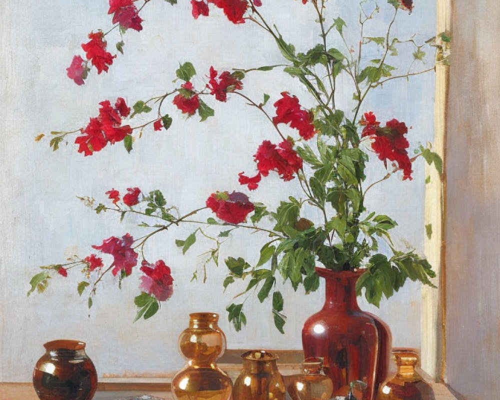 Vibrant red flowers in tall vase with golden-brown pots on sunlit table against blue background