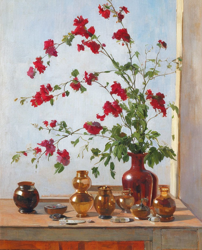 Vibrant red flowers in tall vase with golden-brown pots on sunlit table against blue background